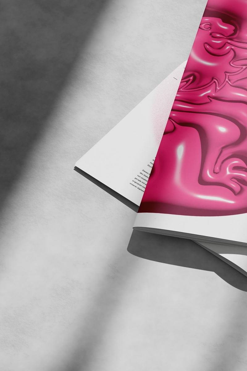 angeschnittenes-Bild-von-Magazin-auf-Betonboden-mit-Schlagschatten-eines-Fensters